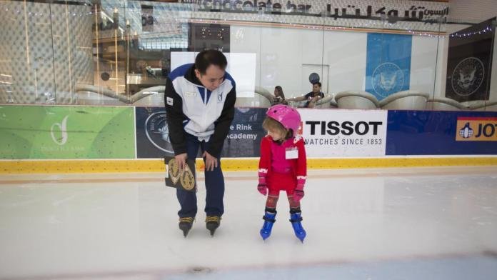 Dubai Ice Rink Coach and Girl Child